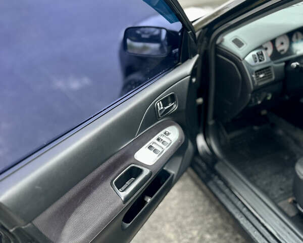 Черный Мицубиси Лансер, объемом двигателя 2 л и пробегом 260 тыс. км за 5300 $, фото 13 на Automoto.ua