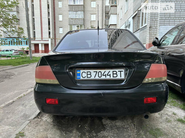 Чорний Міцубісі Lancer, об'ємом двигуна 1.6 л та пробігом 217 тис. км за 4300 $, фото 4 на Automoto.ua