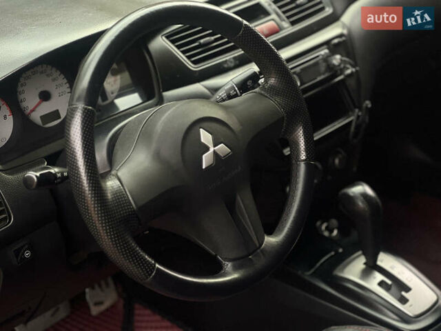 Черный Мицубиси Лансер, объемом двигателя 1.6 л и пробегом 211 тыс. км за 5700 $, фото 22 на Automoto.ua