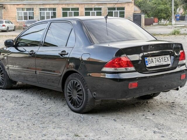 Черный Мицубиси Лансер, объемом двигателя 1.6 л и пробегом 226 тыс. км за 4800 $, фото 2 на Automoto.ua