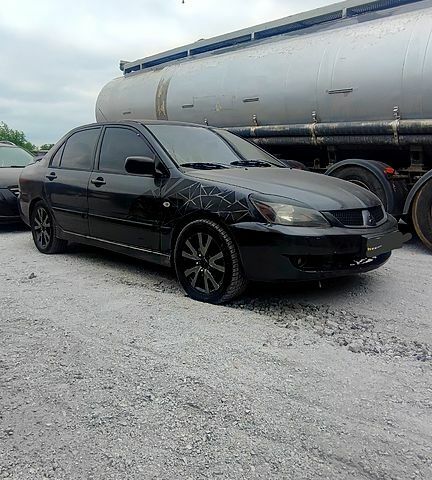 Чорний Міцубісі Lancer, об'ємом двигуна 2 л та пробігом 200 тис. км за 1800 $, фото 5 на Automoto.ua