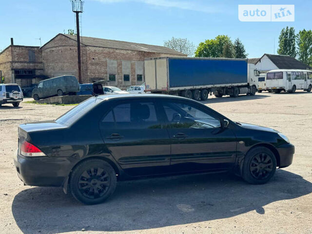 Чорний Міцубісі Lancer, об'ємом двигуна 1.6 л та пробігом 220 тис. км за 4000 $, фото 4 на Automoto.ua