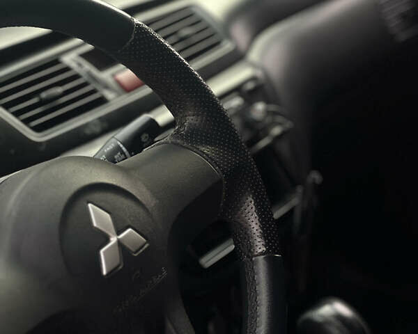 Черный Мицубиси Лансер, объемом двигателя 1.6 л и пробегом 211 тыс. км за 5700 $, фото 25 на Automoto.ua