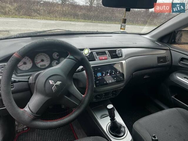 Черный Мицубиси Лансер, объемом двигателя 1.6 л и пробегом 272 тыс. км за 2800 $, фото 14 на Automoto.ua