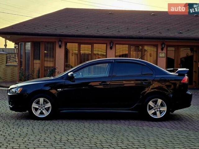 Черный Мицубиси Лансер, объемом двигателя 2 л и пробегом 260 тыс. км за 6555 $, фото 16 на Automoto.ua