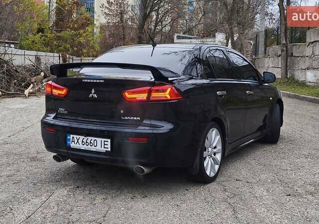 Черный Мицубиси Лансер, объемом двигателя 2 л и пробегом 230 тыс. км за 7100 $, фото 5 на Automoto.ua