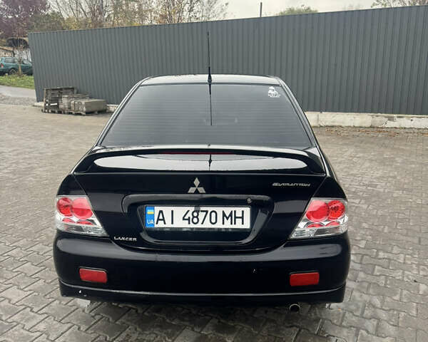 Чорний Міцубісі Lancer, об'ємом двигуна 2 л та пробігом 210 тис. км за 5500 $, фото 50 на Automoto.ua