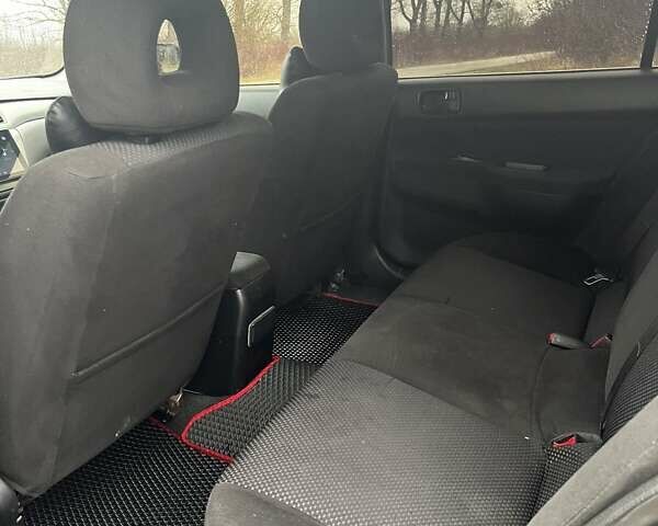 Черный Мицубиси Лансер, объемом двигателя 1.6 л и пробегом 272 тыс. км за 2800 $, фото 8 на Automoto.ua