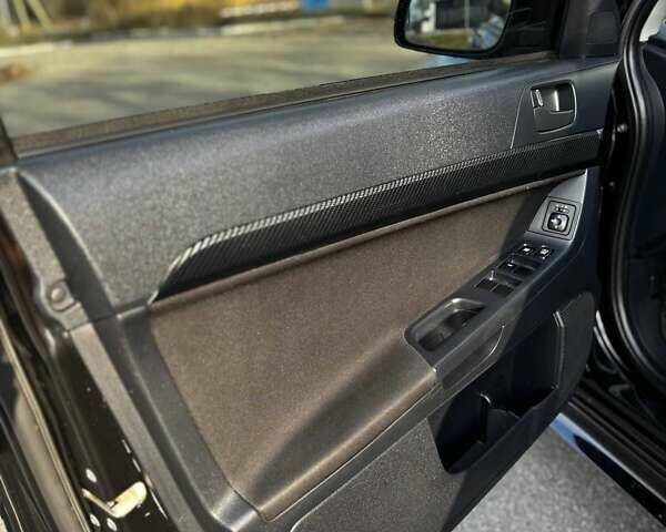 Черный Мицубиси Лансер, объемом двигателя 2 л и пробегом 224 тыс. км за 7000 $, фото 7 на Automoto.ua