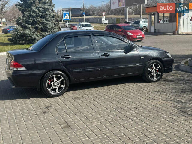 Чорний Міцубісі Lancer, об'ємом двигуна 1.59 л та пробігом 300 тис. км за 3400 $, фото 5 на Automoto.ua