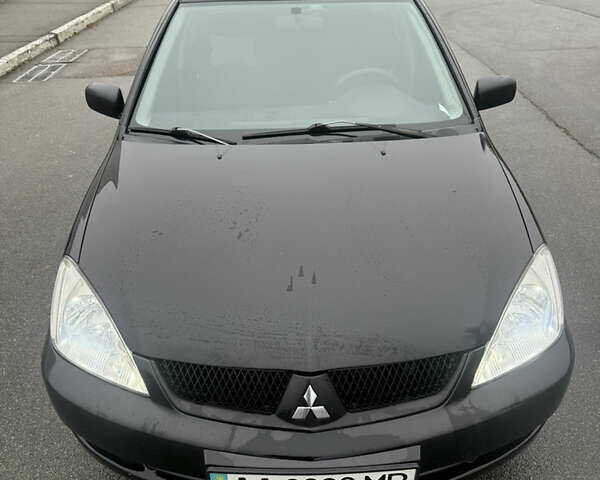 Чорний Міцубісі Lancer, об'ємом двигуна 1.58 л та пробігом 256 тис. км за 3700 $, фото 8 на Automoto.ua
