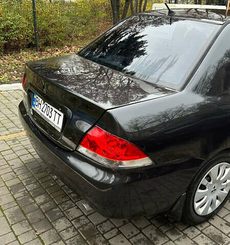 Чорний Міцубісі Lancer, об'ємом двигуна 1.59 л та пробігом 300 тис. км за 3400 $, фото 13 на Automoto.ua