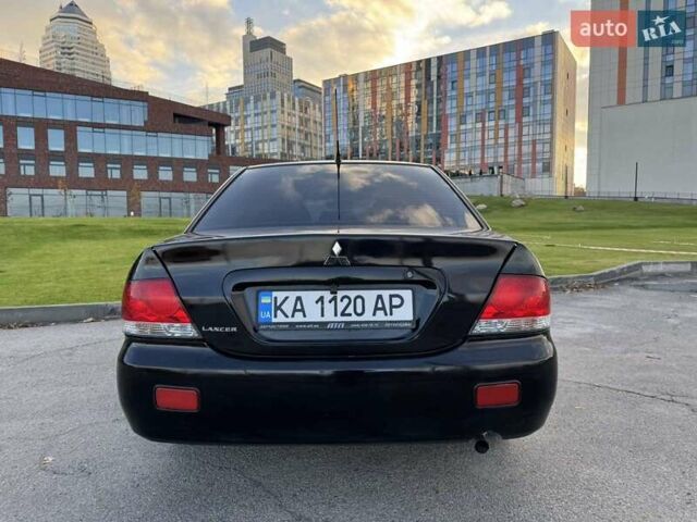 Черный Мицубиси Лансер, объемом двигателя 1.58 л и пробегом 237 тыс. км за 3950 $, фото 6 на Automoto.ua