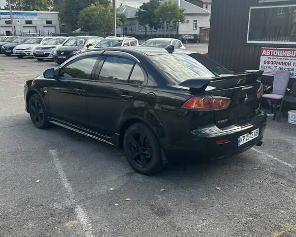 Черный Мицубиси Лансер, объемом двигателя 2 л и пробегом 208 тыс. км за 6500 $, фото 5 на Automoto.ua