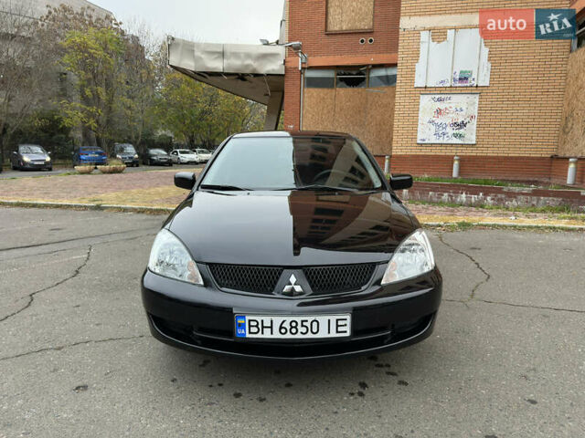 Чорний Міцубісі Lancer, об'ємом двигуна 1.58 л та пробігом 173 тис. км за 4700 $, фото 7 на Automoto.ua