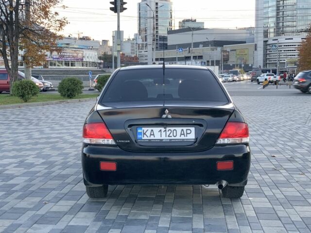 Черный Мицубиси Лансер, объемом двигателя 1.6 л и пробегом 237 тыс. км за 4300 $, фото 6 на Automoto.ua