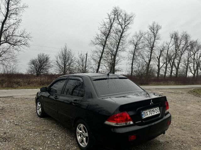 Черный Мицубиси Лансер, объемом двигателя 1.6 л и пробегом 272 тыс. км за 2800 $, фото 2 на Automoto.ua