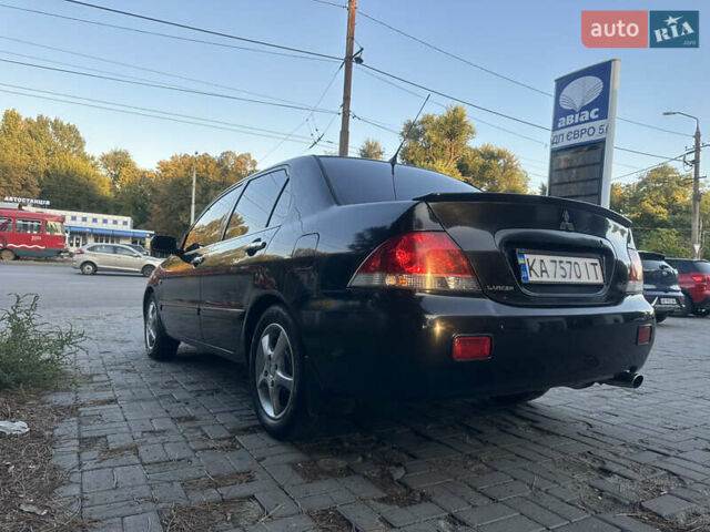 Черный Мицубиси Лансер, объемом двигателя 1.59 л и пробегом 269 тыс. км за 4999 $, фото 1 на Automoto.ua
