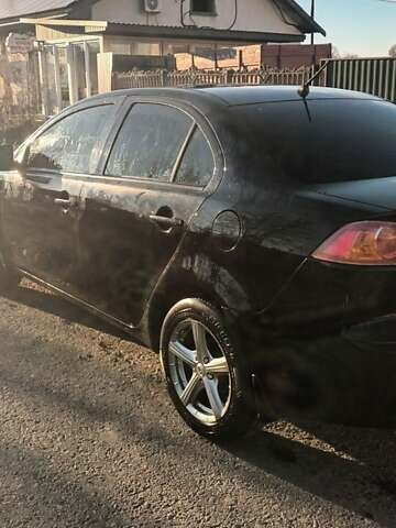 Черный Мицубиси Лансер, объемом двигателя 1.5 л и пробегом 270 тыс. км за 4999 $, фото 5 на Automoto.ua