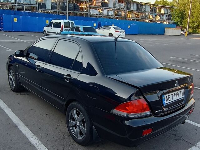 Черный Мицубиси Лансер, объемом двигателя 1.6 л и пробегом 301 тыс. км за 4300 $, фото 2 на Automoto.ua