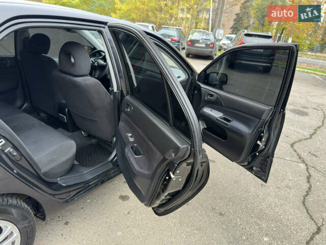 Чорний Міцубісі Lancer, об'ємом двигуна 1.58 л та пробігом 173 тис. км за 4700 $, фото 16 на Automoto.ua