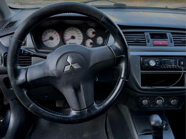 Мицубиси Лансер 2007 в Кременчуге на Automoto.ua Черный Мицубиси Лансер, объемом двигателя 1.6 л и пробегом 230 тыс. км за 4000 $, фото 5 на Automoto.ua