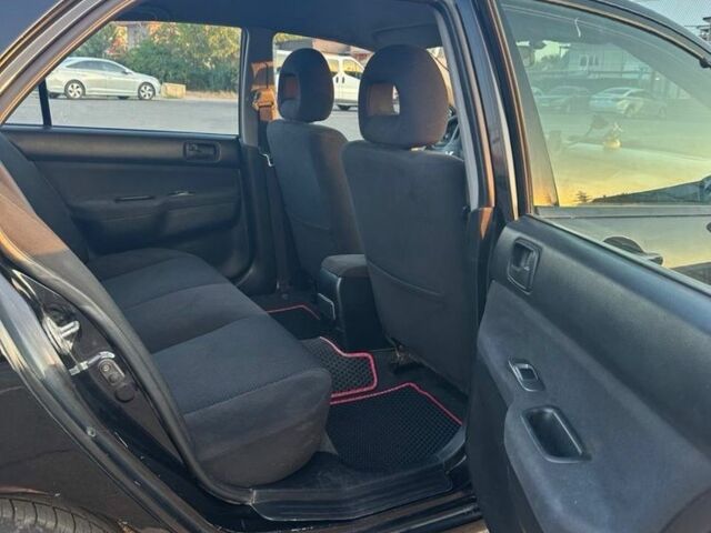 Черный Мицубиси Лансер, объемом двигателя 1.6 л и пробегом 305 тыс. км за 4799 $, фото 7 на Automoto.ua