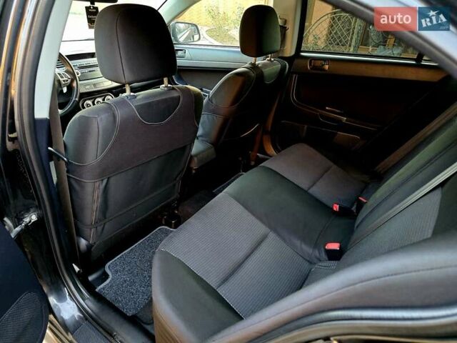 Черный Мицубиси Лансер, объемом двигателя 2 л и пробегом 260 тыс. км за 6555 $, фото 30 на Automoto.ua