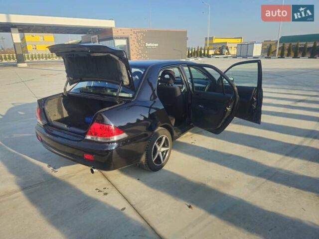 Чорний Міцубісі Lancer, об'ємом двигуна 1.59 л та пробігом 180 тис. км за 4999 $, фото 8 на Automoto.ua