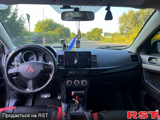 Черный Мицубиси Лансер, объемом двигателя 2 л и пробегом 216 тыс. км за 7500 $, фото 3 на Automoto.ua