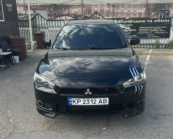 Черный Мицубиси Лансер, объемом двигателя 2 л и пробегом 208 тыс. км за 6500 $, фото 1 на Automoto.ua