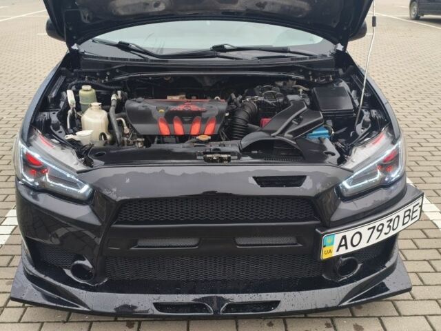 Черный Мицубиси Лансер, объемом двигателя 2 л и пробегом 160 тыс. км за 8000 $, фото 4 на Automoto.ua