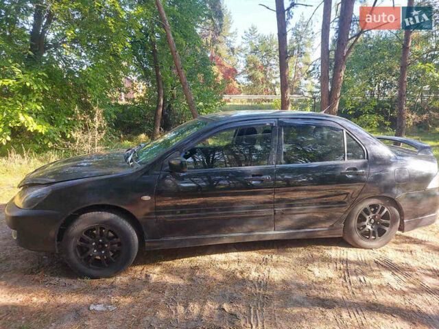 Чорний Міцубісі Lancer, об'ємом двигуна 2 л та пробігом 290 тис. км за 3300 $, фото 1 на Automoto.ua
