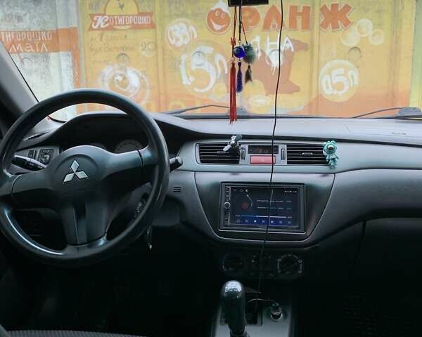 Черный Мицубиси Лансер, объемом двигателя 1.6 л и пробегом 164 тыс. км за 5200 $, фото 8 на Automoto.ua