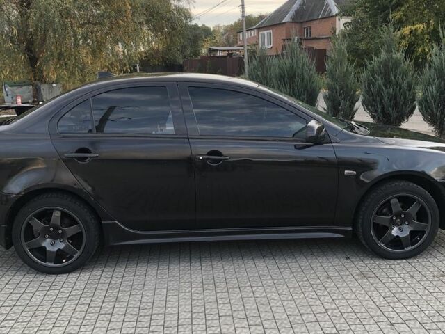 Чорний Міцубісі Lancer, об'ємом двигуна 2 л та пробігом 194 тис. км за 5950 $, фото 2 на Automoto.ua