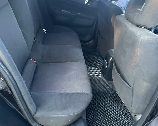 Черный Мицубиси Лансер, объемом двигателя 2 л и пробегом 300 тыс. км за 3999 $, фото 7 на Automoto.ua