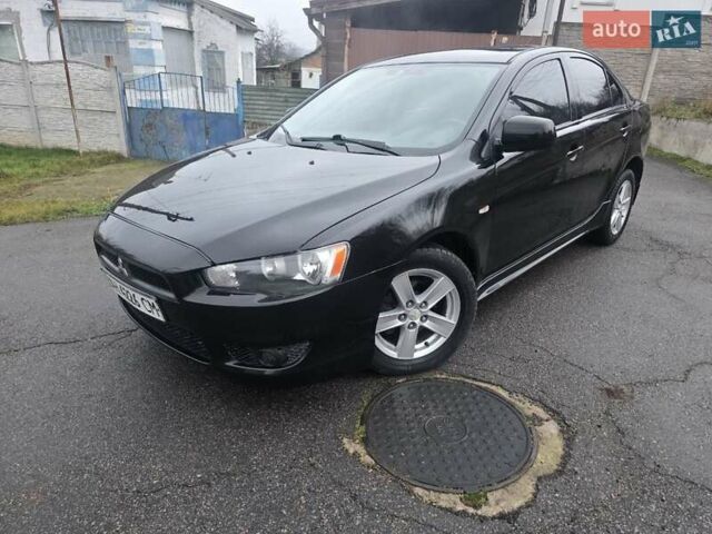 Черный Мицубиси Лансер, объемом двигателя 2 л и пробегом 116 тыс. км за 7200 $, фото 3 на Automoto.ua
