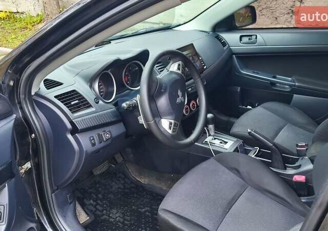 Черный Мицубиси Лансер, объемом двигателя 2 л и пробегом 230 тыс. км за 7100 $, фото 10 на Automoto.ua