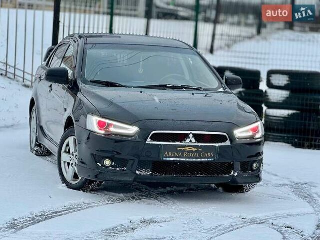 Черный Мицубиси Лансер, объемом двигателя 2 л и пробегом 215 тыс. км за 6300 $, фото 4 на Automoto.ua