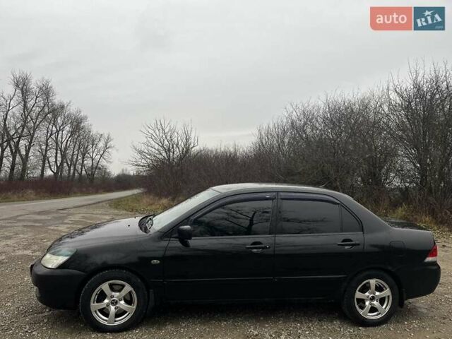 Черный Мицубиси Лансер, объемом двигателя 1.6 л и пробегом 272 тыс. км за 2800 $, фото 2 на Automoto.ua