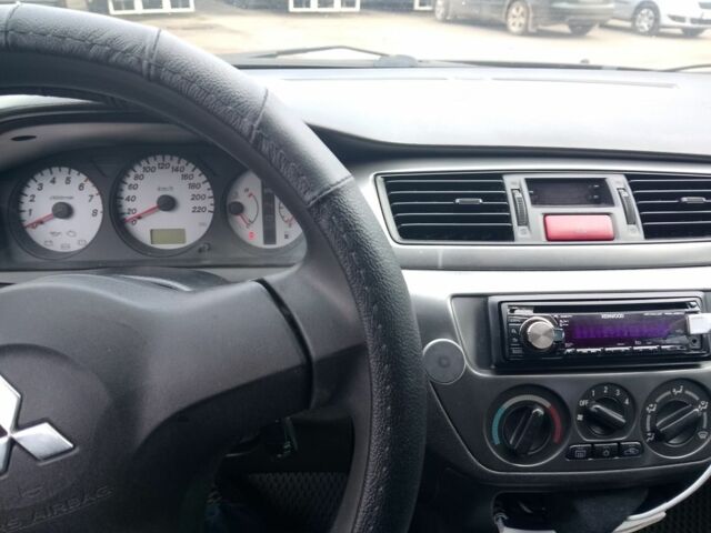 Чорний Міцубісі Lancer, об'ємом двигуна 1.6 л та пробігом 255 тис. км за 5000 $, фото 1 на Automoto.ua