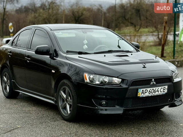 Черный Мицубиси Лансер, объемом двигателя 2 л и пробегом 215 тыс. км за 5500 $, фото 4 на Automoto.ua