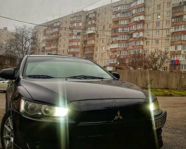 Черный Мицубиси Лансер, объемом двигателя 1.5 л и пробегом 260 тыс. км за 6000 $, фото 1 на Automoto.ua