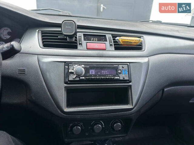 Черный Мицубиси Лансер, объемом двигателя 1.58 л и пробегом 290 тыс. км за 3000 $, фото 9 на Automoto.ua