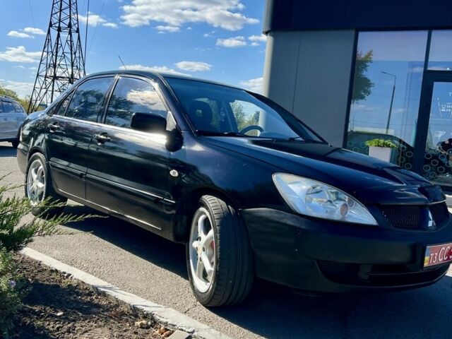 Чорний Міцубісі Lancer, об'ємом двигуна 1.6 л та пробігом 228 тис. км за 3499 $, фото 1 на Automoto.ua