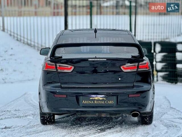 Черный Мицубиси Лансер, объемом двигателя 2 л и пробегом 215 тыс. км за 6300 $, фото 9 на Automoto.ua