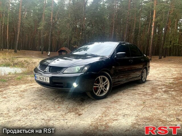 Чорний Міцубісі Lancer, об'ємом двигуна 2 л та пробігом 1 тис. км за 6100 $, фото 1 на Automoto.ua