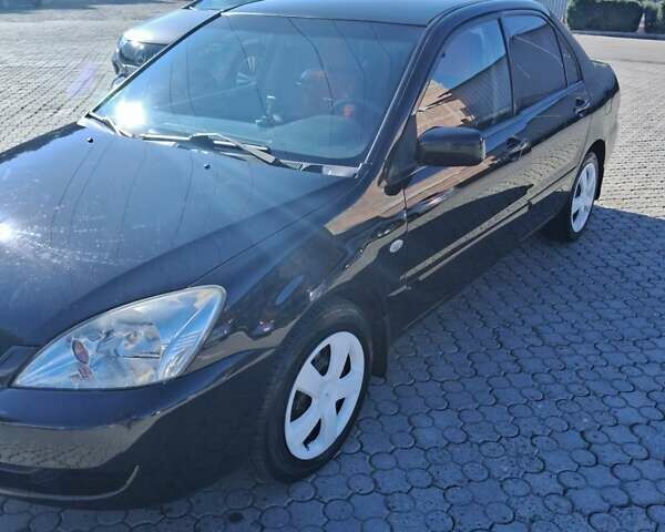 Міцубісі Lancer 2007 у Чернівцях на Automoto.ua Чорний Міцубісі Lancer, об'ємом двигуна 1.58 л та пробігом 247 тис. км за 4300 $, фото 8 на Automoto.ua