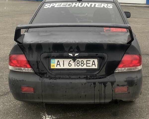 Черный Мицубиси Лансер, объемом двигателя 1.58 л и пробегом 263 тыс. км за 4000 $, фото 36 на Automoto.ua