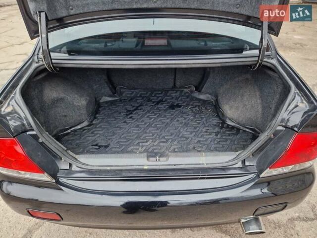 Чорний Міцубісі Lancer, об'ємом двигуна 1.6 л та пробігом 273 тис. км за 3999 $, фото 24 на Automoto.ua